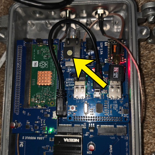 Inside the Nebra Outdoor Gen 1 — the arrow points to the eMMC Key beside the Ethernet port